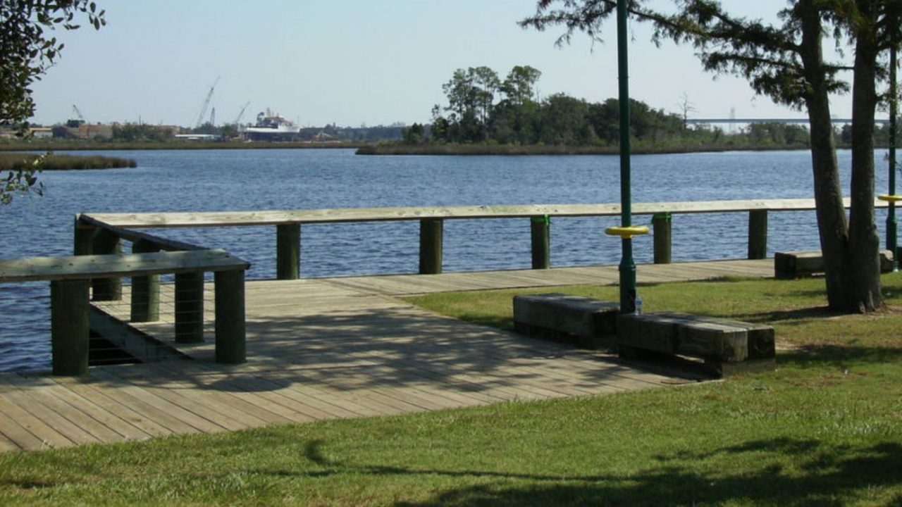 The boardwalk and pier at Riverfront Park reaching out over the Escatawpa River.