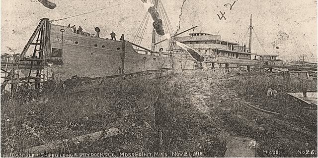 A steamship with MOSS POINT painted on its bow stands in timber scaffolding at the Dantzler shipyard in 1918.