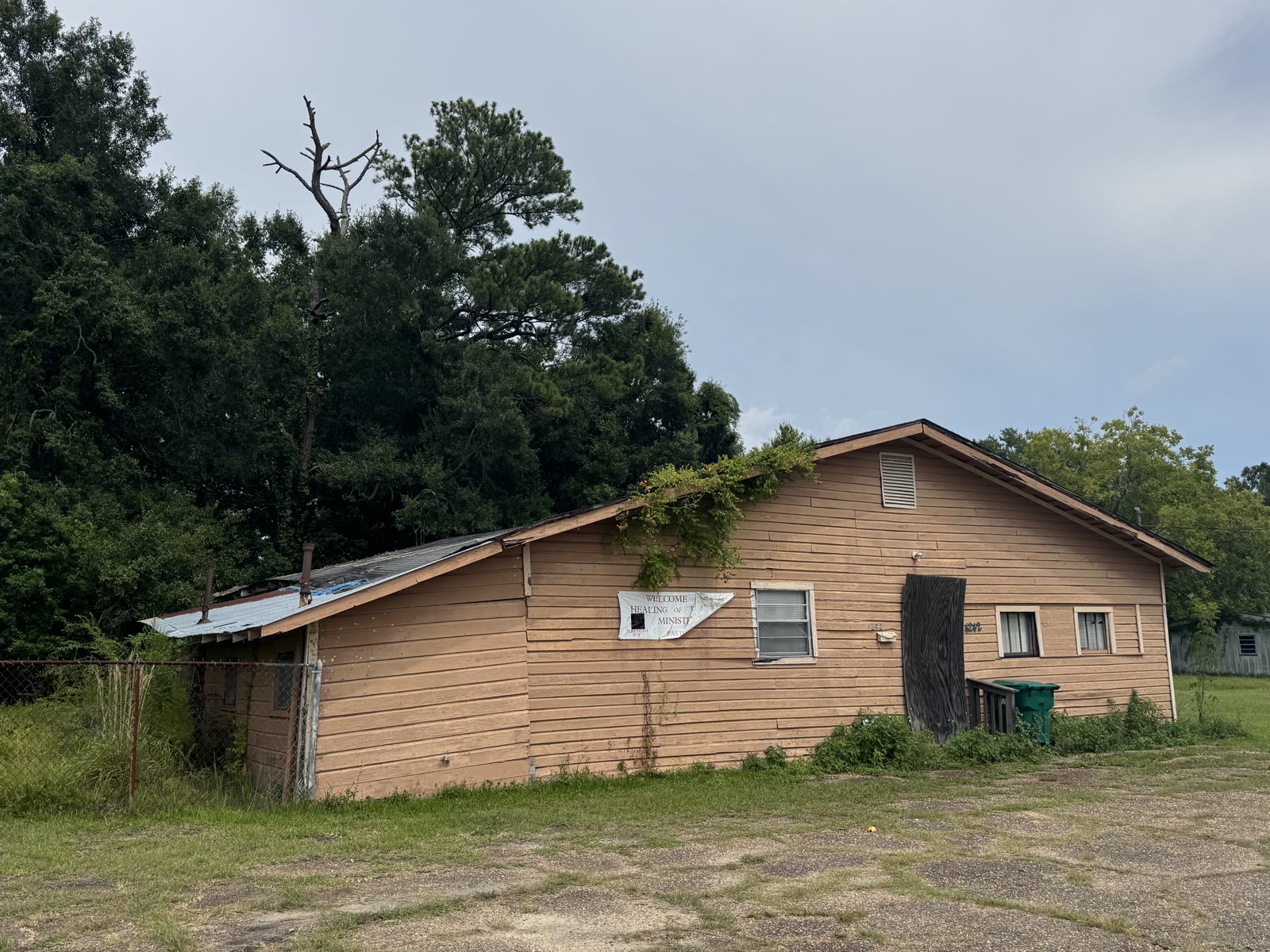 A weathered single story wood building on Magnolia Street in Moss Point, the former Knights of Pythias Hall now used by a ministry, photographed in 2026.