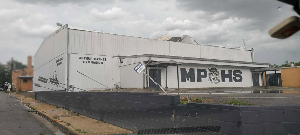 The Arthur Haynes Gymnasium at Moss Point High School with its metal roof peeled open after the tornado.