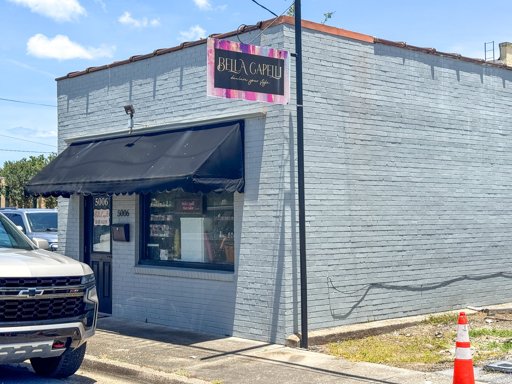 Bella Capelli salon storefront in downtown Moss Point