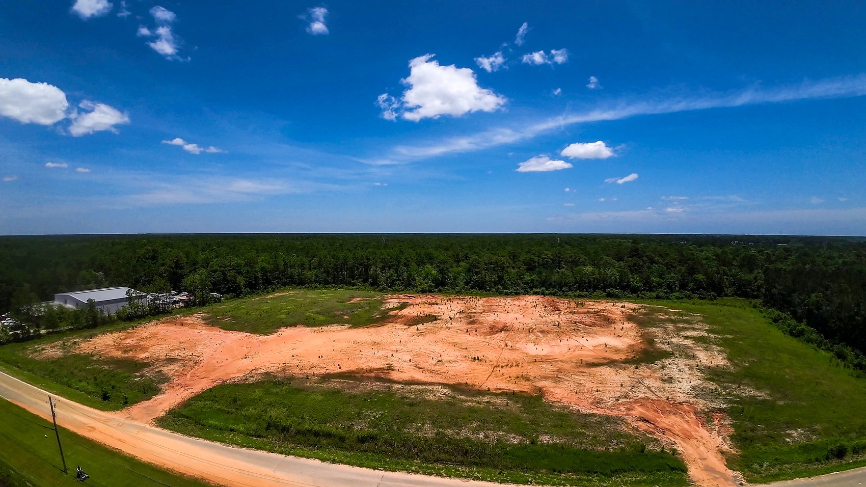 Aerial drone view of the cleared Chrysler-Dodge-Jeep-Ram site on the Hwy 63 corridor