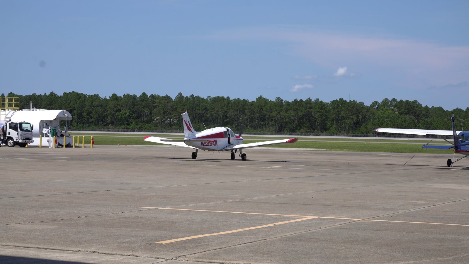 A single-engine light aircraft taxiing on the apron at Trent Lott International Airport