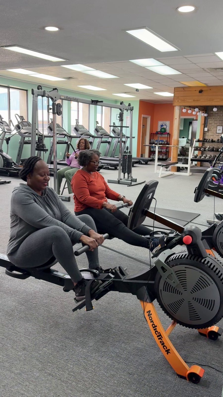 A member on a rowing machine